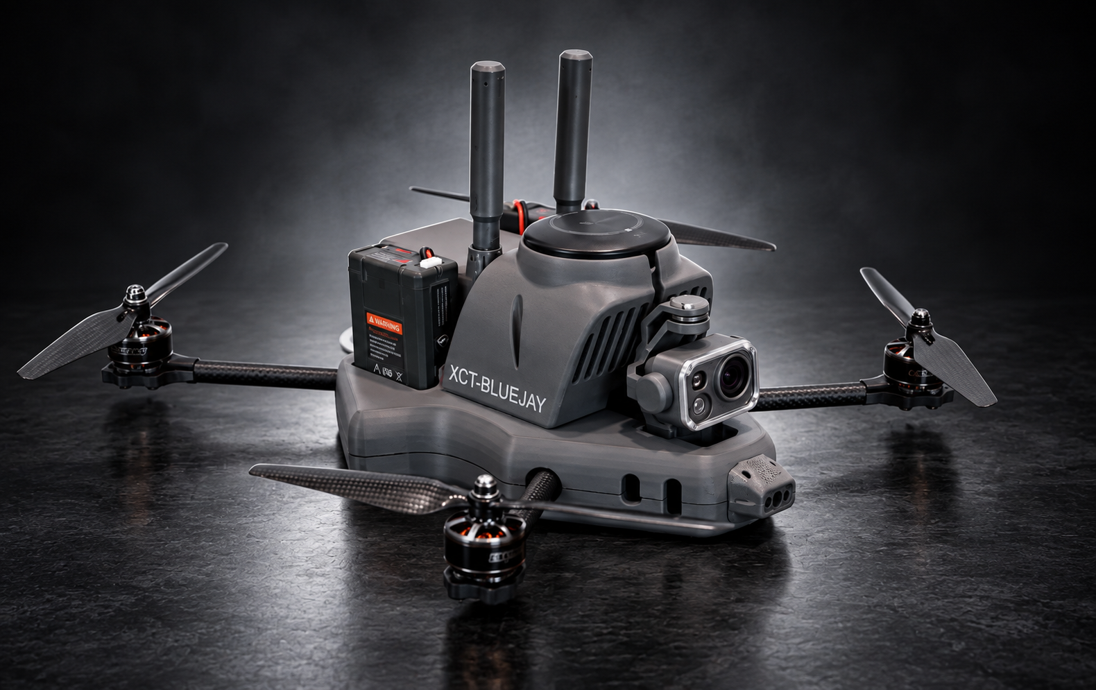 XCaliber BlueJay quadrotor interceptor in a dark studio setting